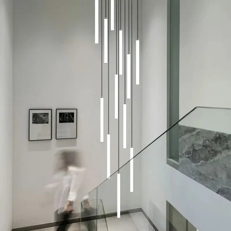 Modern minimalist decorbites led spiral staircase ceiling chandelier with white cylindrical shades and black cords