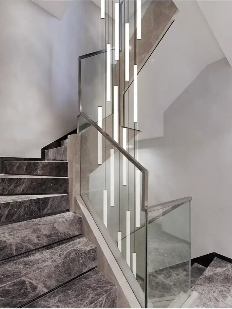 Modern minimalist DecorBites™ led spiral staircase chandelier with slender rectangular led tubes in cascading arrangement