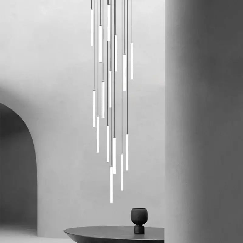 Modern minimalist decorbites™ led spiral staircase chandelier with slender white cylindrical tubes emitting soft glow