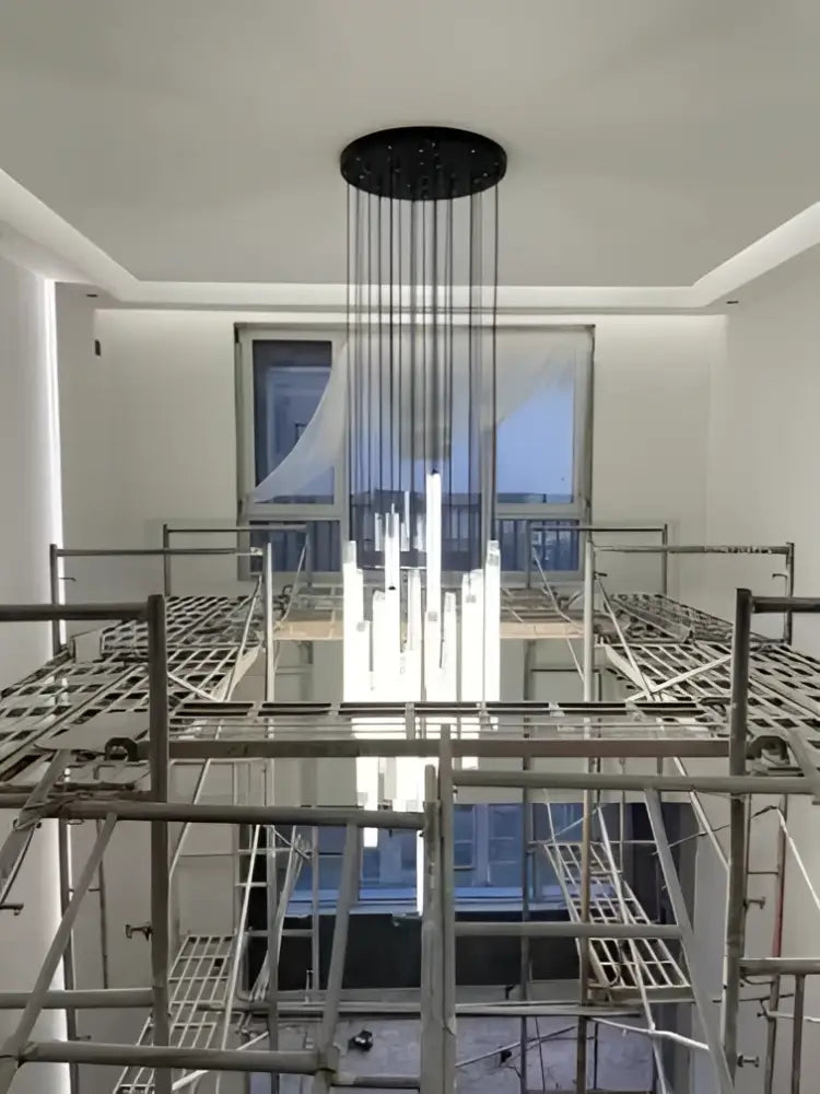 Black circular DecorBites™ LED spiral staircase chandelier with hanging vertical rods for home decoration lighting