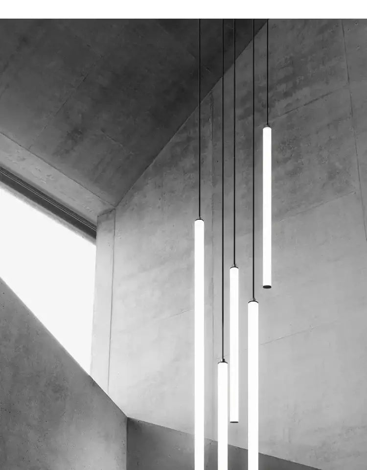 Modern minimalist decorbites™ led spiral staircase chandelier with sleek cylindrical pendant lights and thin black cords