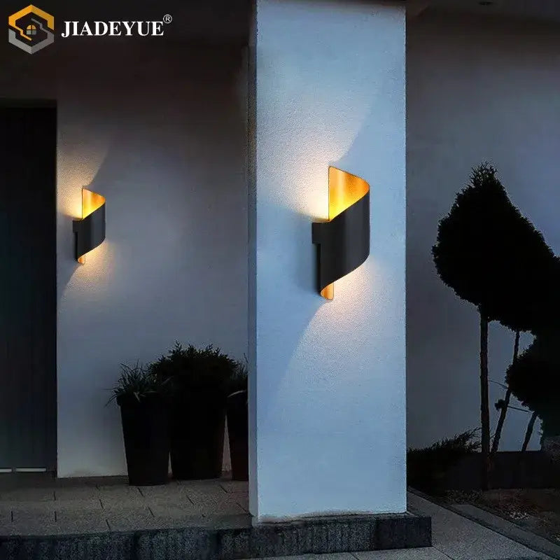 Modern black and gold decorbites led spiral wall sconce with sleek curved design for outdoor and indoor lighting