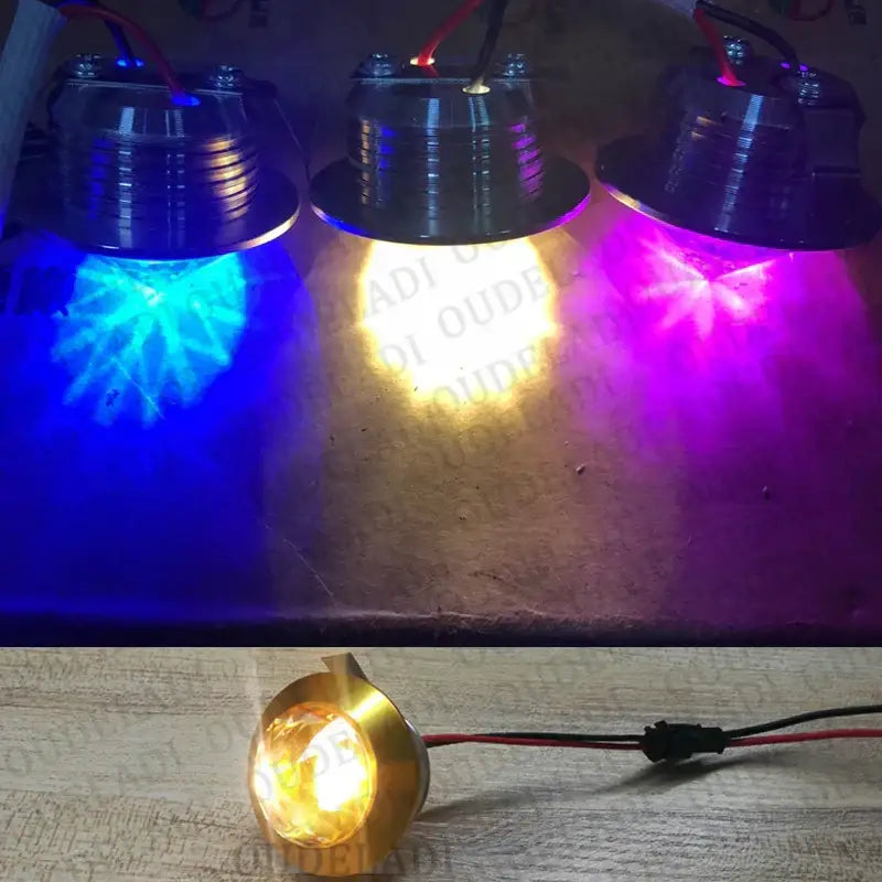 Three metallic decorbites led spot lights emitting blue white and purple hues for home and jewelry cabinet use