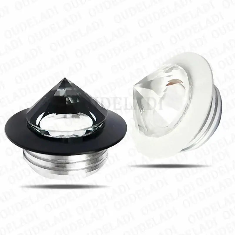 Black and clear faceted crystal plug earrings with metallic bases shown under decorbites led spot light mini 3w downlight