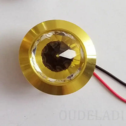 Gold-colored decorbites led spot light mini 3w with faceted crystal lens and visible wiring for home and jewelry cabinet