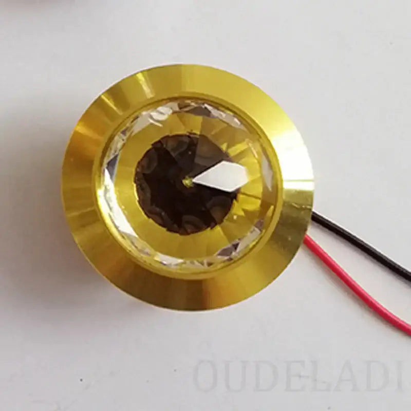 Gold-colored decorbites led spot light mini 3w with faceted crystal lens and visible wiring for home and jewelry cabinet