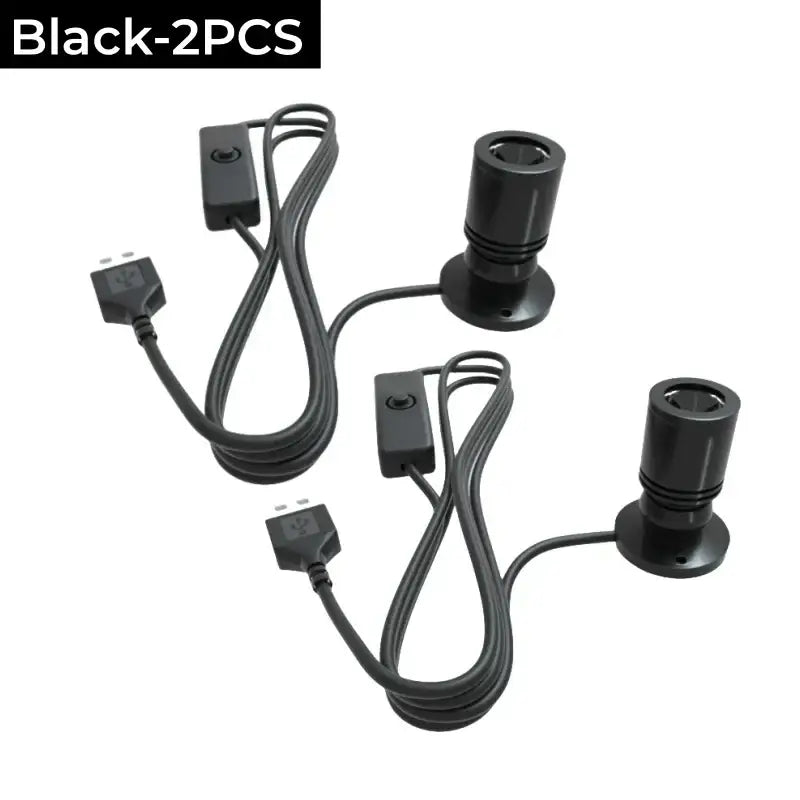Black cylindrical DecorBites LED spotlight fixtures with integrated power cords and switches for cabinet and ceiling use