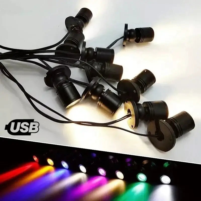 Black usb-powered decorbites led spotlight with adjustable color settings and sleek cylindrical design for cabinets