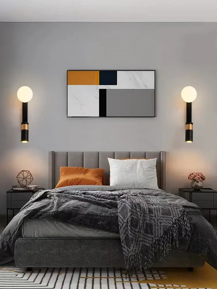 Gray upholstered bed with tufted headboard and layered bedding featuring decorbites led spotlight wall lamp bedside