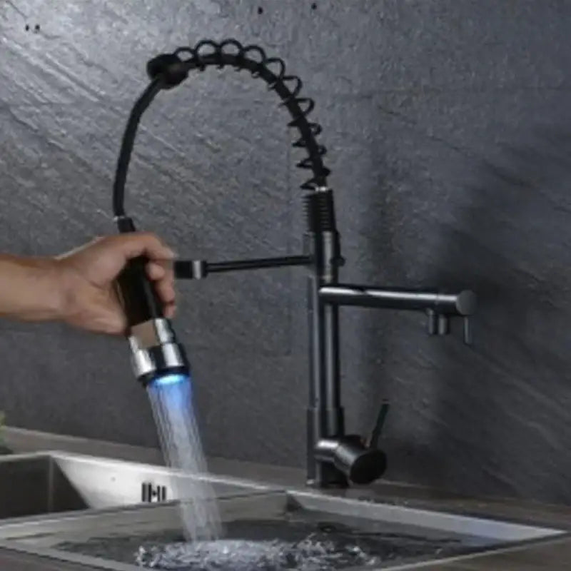 DecorBites LED spring kitchen faucet with black chrome flexible coiled spout and blue LED light nozzle emission