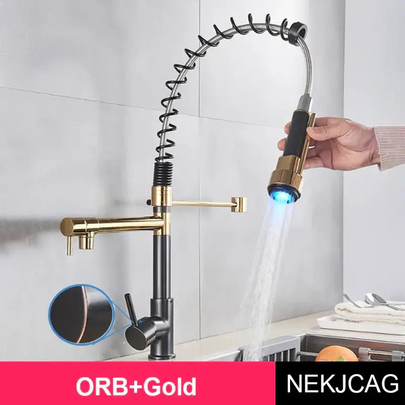 A modern decorbites led spring kitchen faucet with black and gold finish, flexible coiled hose, and blue LED spray head