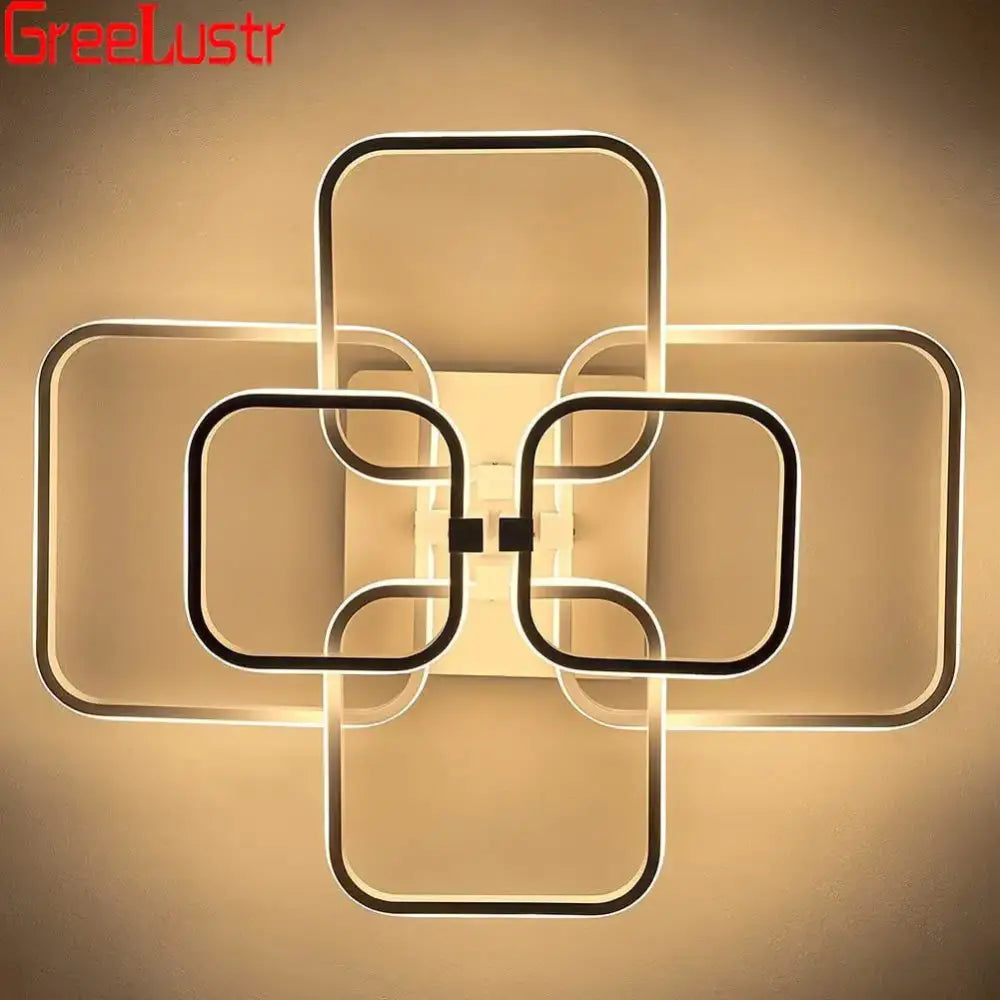 Modern geometric decorbites led square wall sconce with interlocking black and white frames emitting warm ambient glow