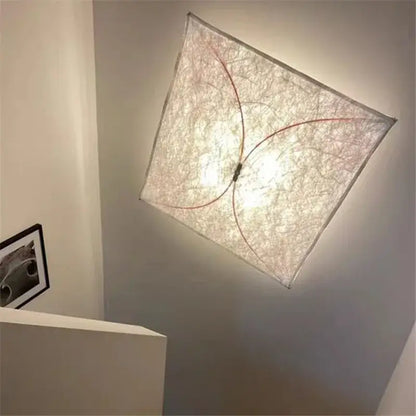 Decorbites led square wall lamp featuring a textured white fabric shade with red wire accents for minimalist decor