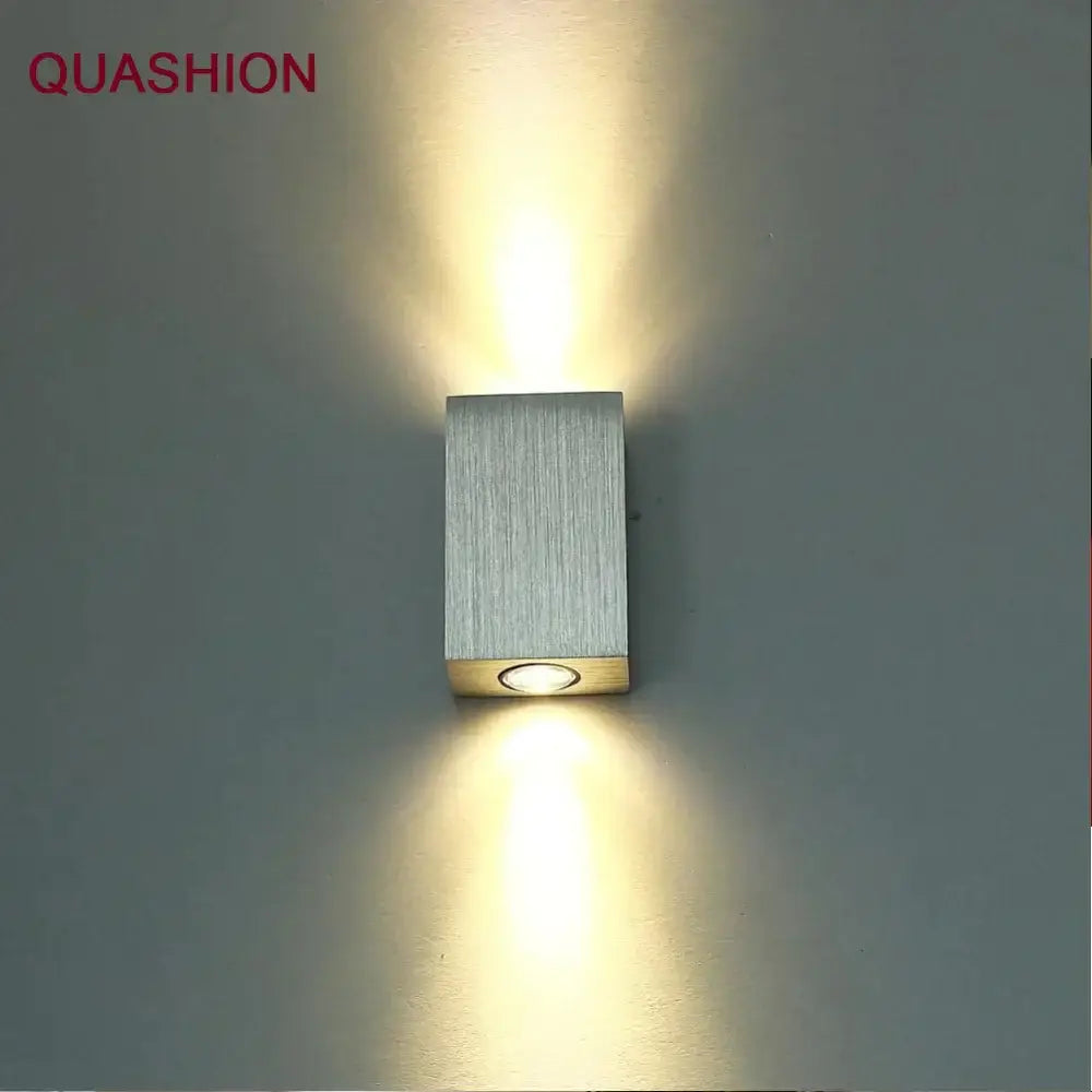 Silver rectangular DecorBites LED square wall lamp with brushed metal finish and warm LED light for bedroom or dining