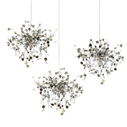 Three modern silver-toned decorbites™ led stainless steel chandelier pendant lights with intricate petal metalwork and circular accents