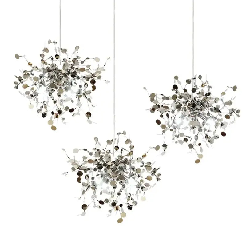 Three modern silver-toned decorbites™ led stainless steel chandelier pendant lights with intricate petal metalwork and circular accents