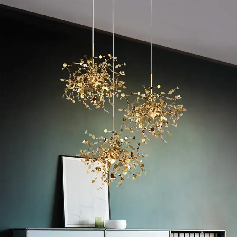 Three golden leaf-inspired led stainless steel chandelier pendant lights for modern home decor lighting by decorbites