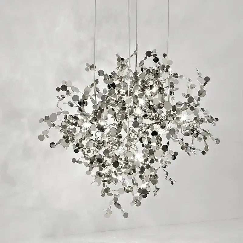 A modern spherical led stainless steel chandelier with reflective silver discs and rods for home decor lighting