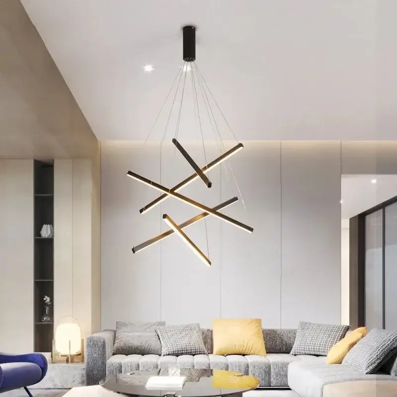 Modern geometric DecorBites™ stair ceiling chandelier with intersecting gold-toned rods and black mount for living room
