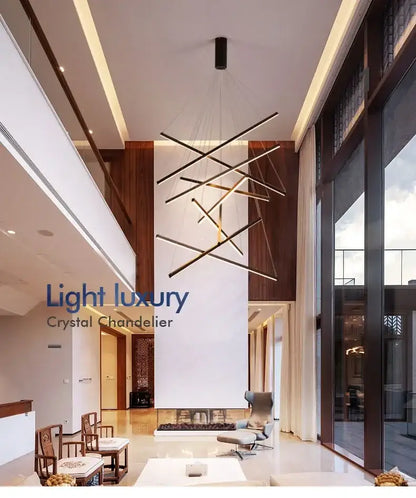 Modern black metal DecorBites™ LED stair ceiling chandelier with intersecting geometric rods for stair ceiling use