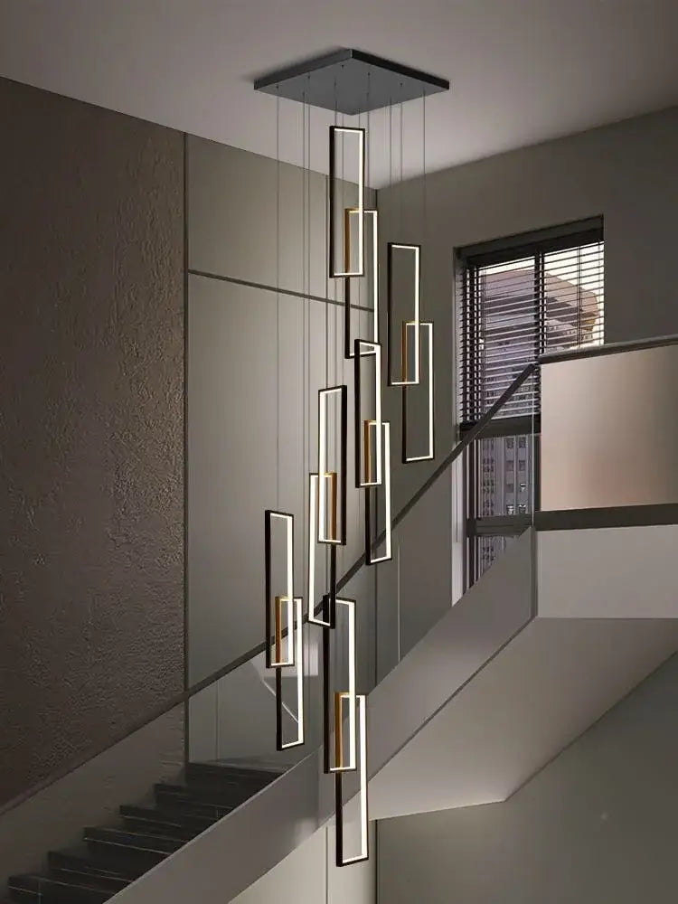 Modern geometric decorbites led stair chandelier with black and gold rectangular fixtures suspended from a square mount