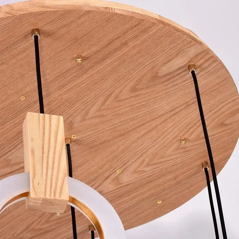 Lightweight wooden circular decorbites led stair chandelier with black cords and gold-toned hardware for modern interiors