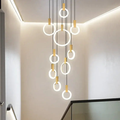 Modern minimalist decorbites led stair chandelier with glowing circular rings and gold connectors for nordic living room