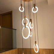 Modern circular decorbites led stair chandelier with warm white led glow and wooden accents for nordic living rooms