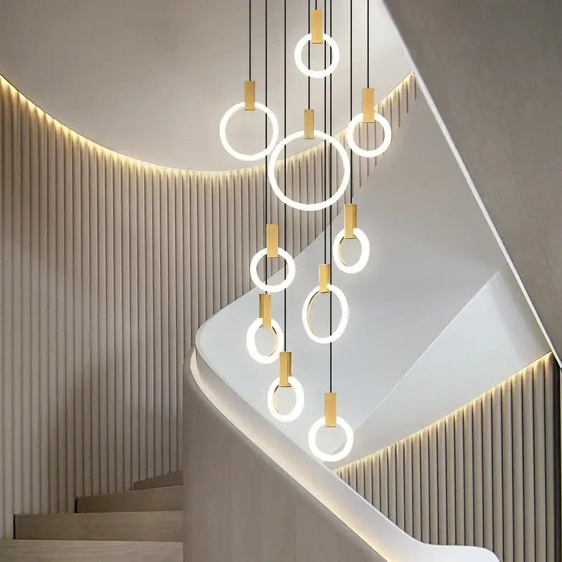 Modern decorbites led stair chandelier with gold-toned metal and glowing white rings for nordic living room ceiling