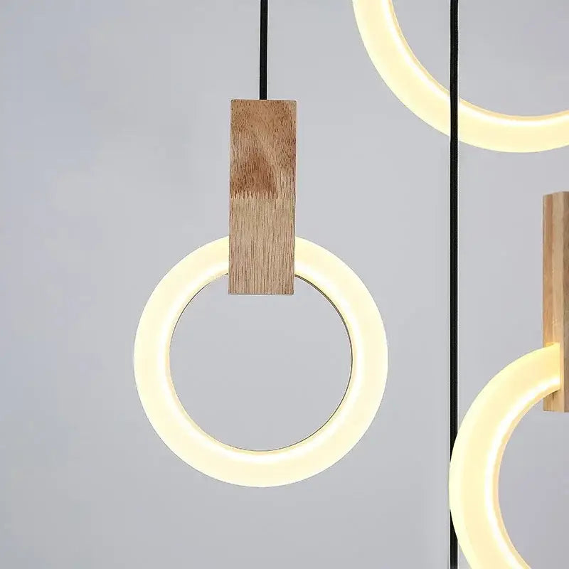 Modern minimalist decorbites led stair chandelier with glowing circular ring and natural wood accent for living room ceiling