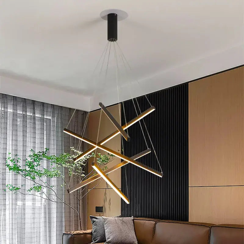 Decorbites led stair chandelier with modern gold-toned metal rods and black cylindrical ceiling mount for indoor lighting