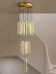 Gold-toned DecorBites LED staircase branch chandelier with sleek elongated oval LED lights for modern living rooms
