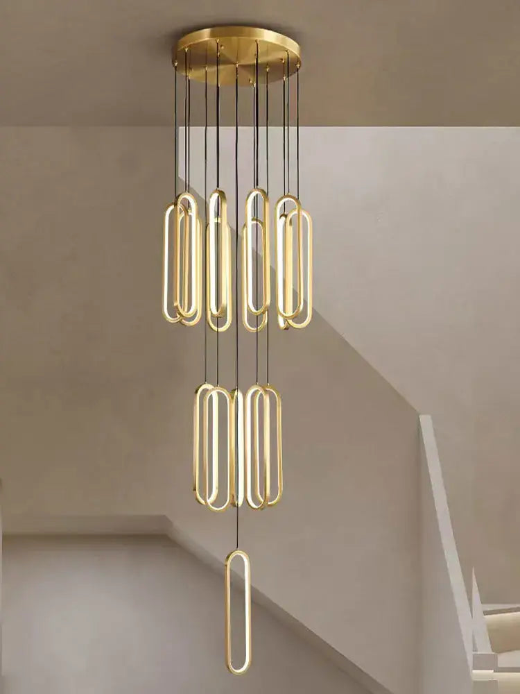 Gold-toned DecorBites LED staircase branch chandelier with sleek elongated oval LED lights for modern living rooms