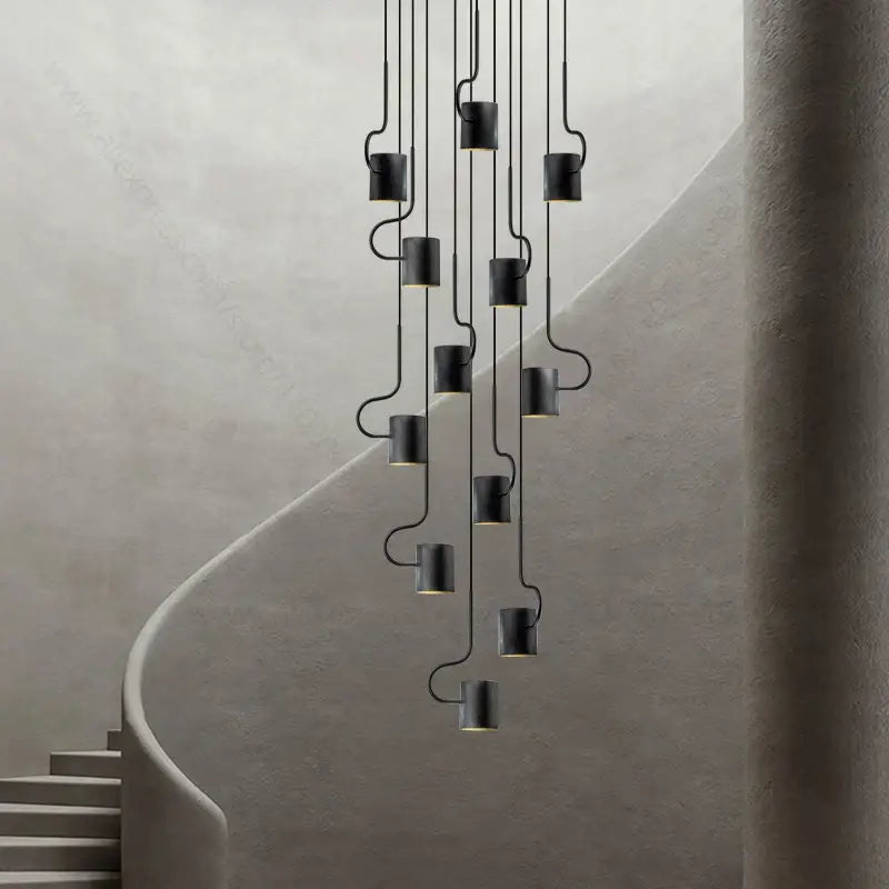 Black cylindrical DecorBites LED staircase chandelier with curved metal arms for modern villa living room lighting