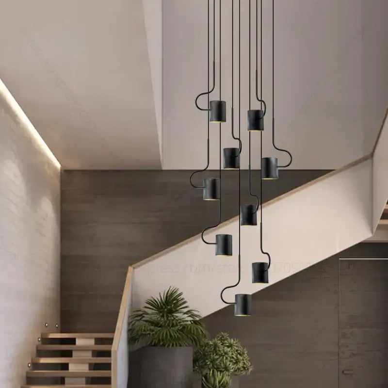 Black cylindrical decorbites led staircase chandelier with curved metal arms in adjustable modern villa lighting design
