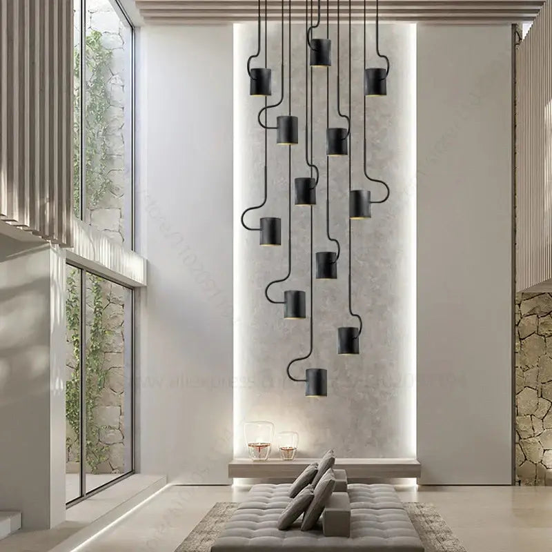 Black cylindrical pendant lights with curved metal arms in decorbites led staircase chandelier for modern villa lighting
