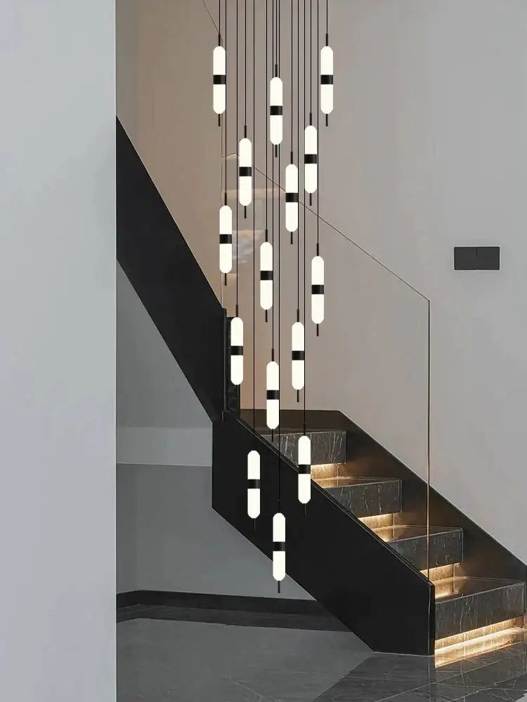 Modern minimalist decorbites led staircase chandelier with cylindrical frosted glass shades and black metal accents ceiling fixture