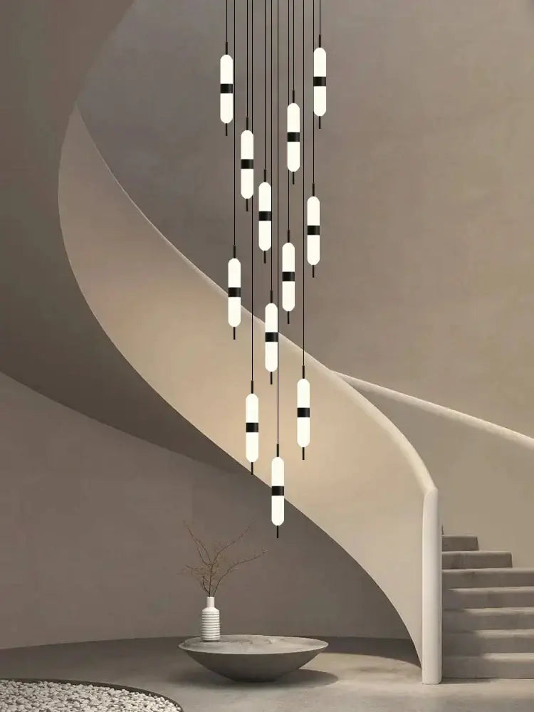 Modern minimalist decorbites led staircase chandelier with white frosted glass and black accents for ceiling lighting
