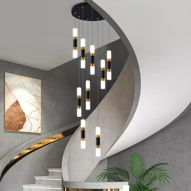 Modern black and gold cylindrical led staircase chandelier pendant lights hanging from a circular ceiling fixture