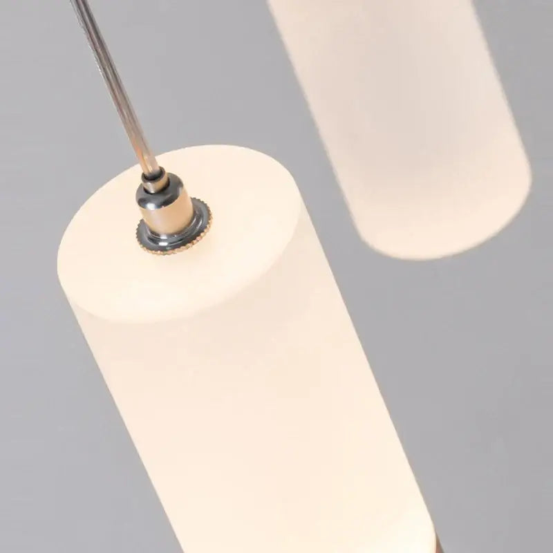 Off-white led staircase chandelier with frosted glass shade and polished chrome hardware for modern duplex lighting