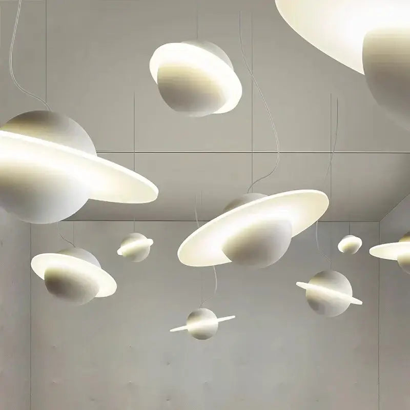 White planetary-themed decorbites led staircase chandelier with glowing rings and smooth matte finish for living room decor