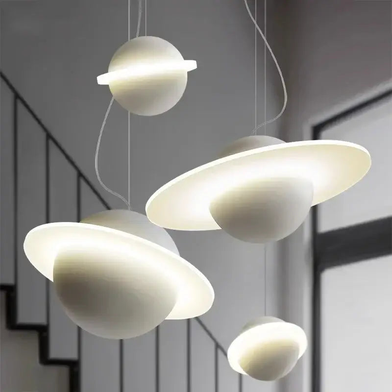 Modern white planetary-themed pendant lights with glowing rings and matte finish in decorbites led staircase chandelier