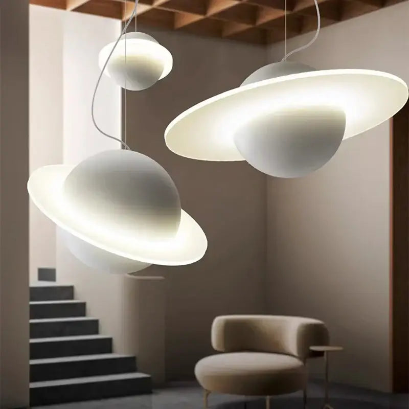 Modern white planetary-themed decorbites led staircase chandelier with glowing rings and minimalist pendant light design