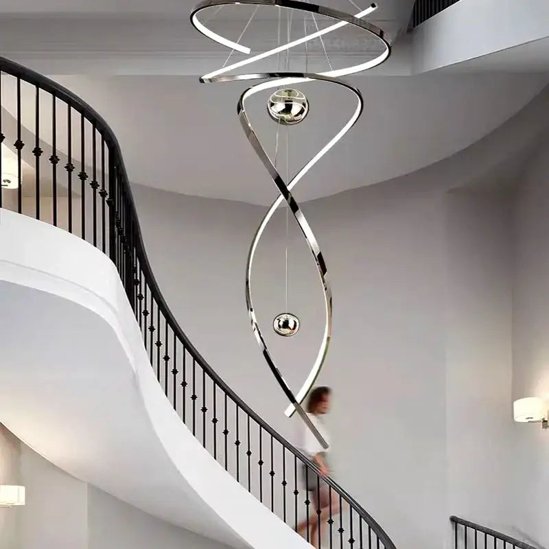 A sleek decorbites led staircase pendant light with polished chrome finish and integrated led lighting for indoor use