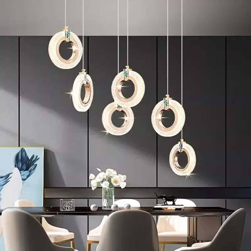 Modern decorbites led staircase chandelier with clear crystal accents and gold-toned metal frame for indoor lighting