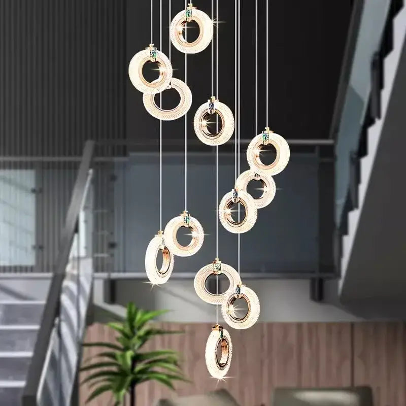 Modern gold-toned crystal led staircase chandelier with cascading circular lights by decorbites led for indoor use