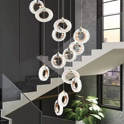 Modern gold-toned circular decorbites led staircase chandeliers with crystal accents for indoor living room lighting