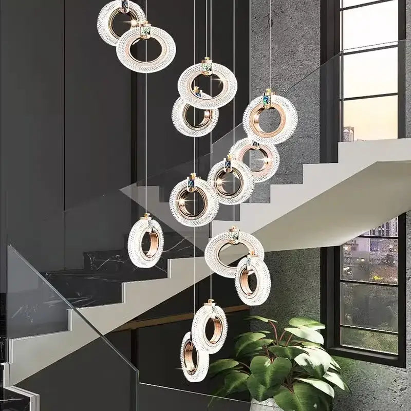 Modern gold-toned circular decorbites led staircase chandeliers with crystal accents for indoor living room lighting