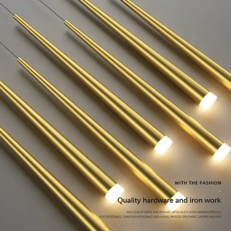 Gold-colored cylindrical pendant decorbites led staircase chandeliers with frosted glass ends emitting warm glow