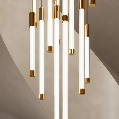 Modern decorbites™ led staircase chandeliers featuring white cylindrical tubes with polished gold accents for luxury lighting
